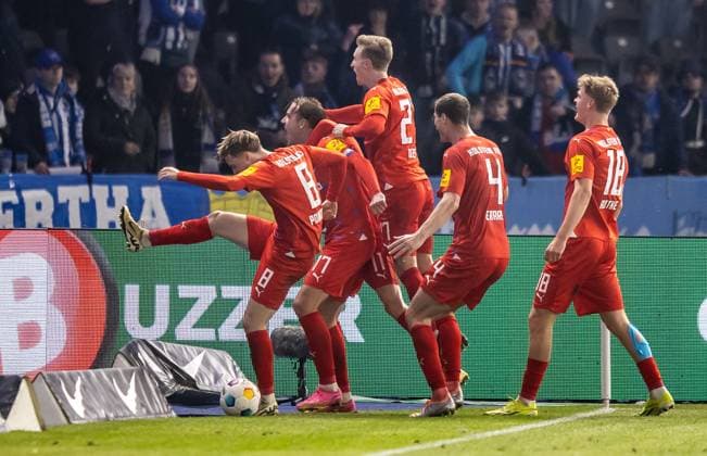 Berlin, 01 03 2024, Soccer, 2 Bundesliga, Matchday 24, Hertha BSC Holstein Kiel, Olympiastadion Kiels Timo Becker 2 v l cheers with teammates after his goal to 2 2 DFL regulations and DFB regulations prohibit any use of photographs as image sequences and or quasi video, Foto Andreas Gora Hertha BSC Holstein Kiel