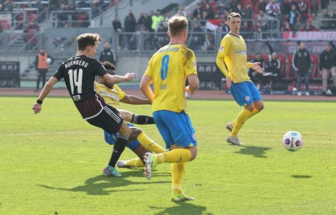 02 03 2024 Soccer Season 2023 2024 2 Soccer Bundesliga 24 Matchday 1 FC Nürnberg FCN Club BTSV Eintracht Braunschweig EBS Sportfoto Zink DaMa xdaxmax DFL regulations prohibit any use of photographs as image sequences and or quasi video only for editorial use Benjamin Goller 14, 1 FC Nürnberg FCN with shot on goal