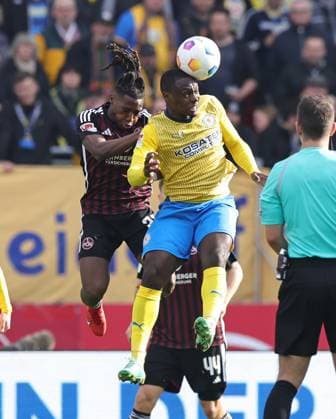 02 03 2024 Soccer Season 2023 2024 2 Soccer Bundesliga 24 Matchday 1 FC Nürnberg FCN Club BTSV Eintracht Braunschweig EBS Sportfoto Zink DaMa xdaxmax DFL regulations prohibit any use of photographs as image sequences and or quasi video only for editorial use Joseph Hungbo 23, 1 FC Nürnberg FCN Anthony Ujah 14, Eintracht Braunschweig BTSV EBS