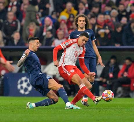 05 03 2024, Football UEFA Champions League 2023 2024 Round of 16, FC Bayern Munich Lazio Rome, in the Allianz Arena Munich v l Matias Vencino Lazio Rome against Jamal Musiala FC Bayern Munich and Matteo Guendouzi Lazio Rome in a duel for the ball DFL and DFB regulations prohibit any use of photographs as image sequences and or quasi video