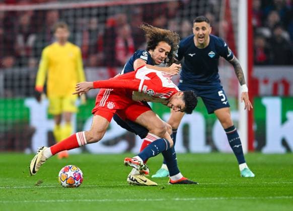 Germany, Muenchen, 05 03 2024, Allianz Arena, FC Bayern Muenchen vs SS Lazio UEFA Champions League 2023 24 Round of 16 Second Leg, Aleksandar Pavlovic Bayern Muenchen and Matteo Guendouzi SS Lazio battle for the ball Munich Allianz Arena Bavaria Germany eu-images-738