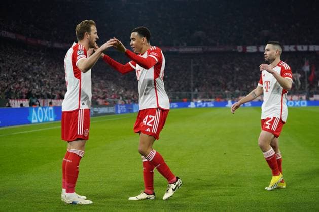 Harry Kane 9 FC Bayern , Jamal Musiala 42 FC Bayern and Raphael Guerreiro 22 FC Bayern celebrate the 1-0 goal during the Champions League match FC Bayern Munich Lazio Rome on 05 03 2024 Munich Allianz Arena Bayern Germany