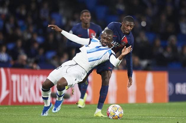 Hamary Traore of Real Sociedad (L) battles for the ball with Ousmane Dembele of Paris Saint Germain (R) during the UEFA Champions League match between Real Sociedad v Paris Saint Germain at Reale Arena on March 5, 2024 in San Sebastian (Photo by: LGM) FOOTBALL : Real Sociedad vs Paris Saint Germain - UEFA Ligue des Champions - 05 03 2024 LGM Panoramic 