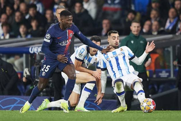 Brais MÃ ndez of Real Sociedad (R) battles for the ball with Nuno Mendes of Paris Saint Germain (L) during the UEFA Champions League match between Real Sociedad v Paris Saint Germain at Reale Arena on March 5, 2024 in San Sebastian (Photo by: LGM) FOOTBALL : Real Sociedad vs Paris Saint Germain - UEFA Ligue des Champions - 05 03 2024 LGM Panoramic 
