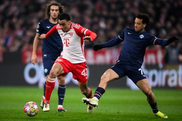 FC Bayern Munich v SS Lazio - UEFA Champions League Jamal Musiala of FC bayern Munchen competes for the ball with Felipe Anderson of SS Lazio during the UEFA Champions League round of 16 second leg football match between FC Bayern Munich and SS Lazio. Munich Germany Copyright: xNicolòxCampox