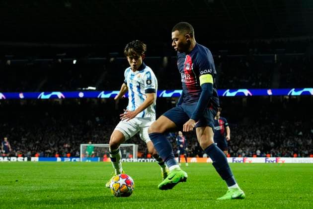 Real Sociedad v Paris Saint-Germain: Round of 16 Second Leg - UEFA Champions League 2023 24 Kylian Mbappe Centre-Forward of PSG and France and Takefusa Kubo right winger of Real Sociedad and Japan compete for the ball during the UEFA Champions League 2023 24 round of 16 second leg match between Real Sociedad and Paris Saint-Germain at Reale Arena on March 5, 2024 in San Sebastian, Spain. San Sebastian Spain  Copyright: xJosexBretonx originalFilename:breton-realsoci240305_npMF6.jpg