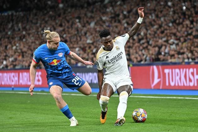 Madrid, Estadio Santiago Bernabeu, 06 03 24, GER, Men, UEFA Champions League, Season 2023 2024, Round of 16, Real Madrid CF RB Leipzig Picture from left in duel Xaver SCHLAGER Leipzig and VINICIUS JUNIOR Real Madrid Only for editorial use UEFA regulations prohibit any use of photographs as image sequences and or quasi video Spain