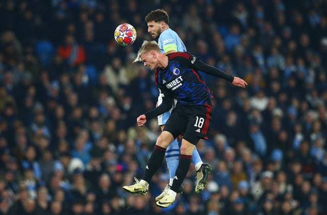 Ruben Dias of Manchester City challenges with Orri Steinn Oskarsson of FC Kobenhavn to an ariel ball Manchester City v FC Copenhagen, UEFA Champions League, Round of 16, Second Leg, Football, Etihad Stadium, Manchester, UK - 06 Mar 2024 EDITORIAL USE ONLY No use with unauthorised audio, video, data, fixture lists, club league logos or live services. Online in-match use limited to 120 images, no video emulation. No use in betting, games or single club league player publications. Copyright: xMattxWest Shutterstockx 14373648ah