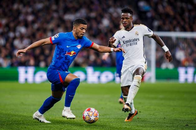 March 6, 2024, Madrid, Spain: Benjamin Henrichs of RB Leipzig battles for the ball with Vinicius Junior of Real Madrid CF during the Champions League match between Real Madrid and RB Leipzig at Santiago Bernabeu Stadium on March 6, 2024 in Madrid, Spain. Madrid Spain - ZUMAd159 20240306_zia_d159_019 Copyright: xMaxDexGraciaxJimenezx
