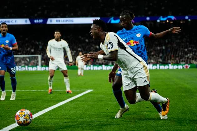 Real Madrid CF v RB Leipzig: Round of 16 Second Leg - UEFA Champions League 2023 24 Vinicius Junior left winger of Real Madrid and Brazil and Amadou Haidara Central Midfield of RB Leipzig and Mali compete for the ball during the UEFA Champions League 2023 24 round of 16 second leg match between Real Madrid CF and RB Leipzig at Estadio Santiago Bernabeu on March 6, 2024 in Madrid, Spain. Madrid Spain  Copyright: xJosexBretonx originalFilename:breton-realmadr240306_npGKQ.jpg