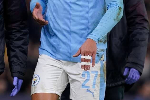 MANCHESTER, ENGLAND, 6th March 2024. Matheus Nunes of Manchester City leaves the pitch after he suffers a dislocated finger during the UEFA Champions League match at the Etihad Stadium, MANCHESTER. Picture credit should read: Andrew Yates Sportimage EDITORIAL USE ONLY. No use with unauthorised audio, video, data, fixture lists, club league logos or live services. Online in-match use limited to 120 images, no video emulation. No use in betting, games or single club league player publications. SPI-2988-0067