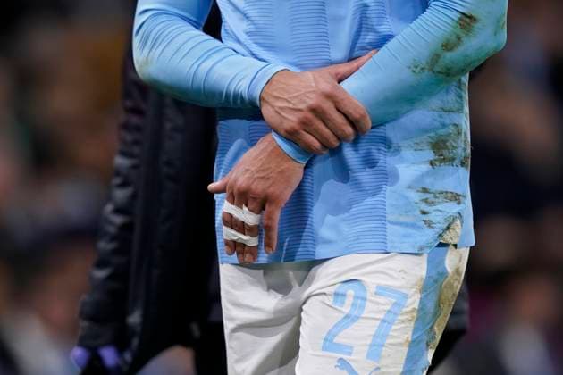 MANCHESTER, ENGLAND, 6th March 2024. Matheus Nunes of Manchester City leaves the pitch after he suffers a dislocated finger during the UEFA Champions League match at the Etihad Stadium, MANCHESTER. Picture credit should read: Andrew Yates Sportimage EDITORIAL USE ONLY. No use with unauthorised audio, video, data, fixture lists, club league logos or live services. Online in-match use limited to 120 images, no video emulation. No use in betting, games or single club league player publications. SPI-2988-0068