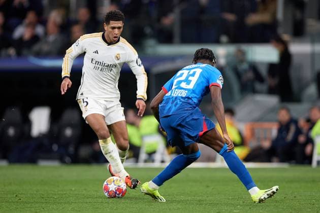 Jude Bellingham of Real Madrid CF (L) in action during the UEFA Champions League match between Real Madrid v RB Leipzig at Santiago Bernabeu on March 6, 2024 in Madrid (Photo by: LGM) FOOTBALL : Real Madrid vs RB Leipzig - UEFA Ligue des Champions - 06 03 2024 LGM Panoramic 