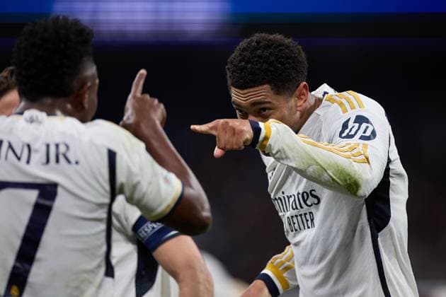 Sport Bilder des Tages Jude Bellingham of Real Madrid CF (R) celebrates his goal scores by Vinicius Junior of Real Madrid CF (L) during the UEFA Champions League match between Real Madrid v RB Leipzig at Santiago Bernabeu on March 6, 2024 in Madrid (Photo by: LGM) FOOTBALL : Real Madrid vs RB Leipzig - UEFA Ligue des Champions - 06 03 2024 LGM Panoramic 