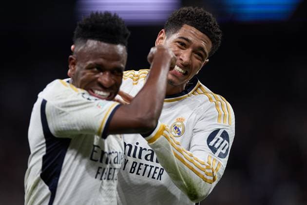 Vinicius Junior of Real Madrid CF (L) celebrates his goal with Jude Bellingham of Real Madrid CF (R) during the UEFA Champions League match between Real Madrid v RB Leipzig at Santiago Bernabeu on March 6, 2024 in Madrid (Photo by: LGM) FOOTBALL : Real Madrid vs RB Leipzig - UEFA Ligue des Champions - 06 03 2024 LGM Panoramic 