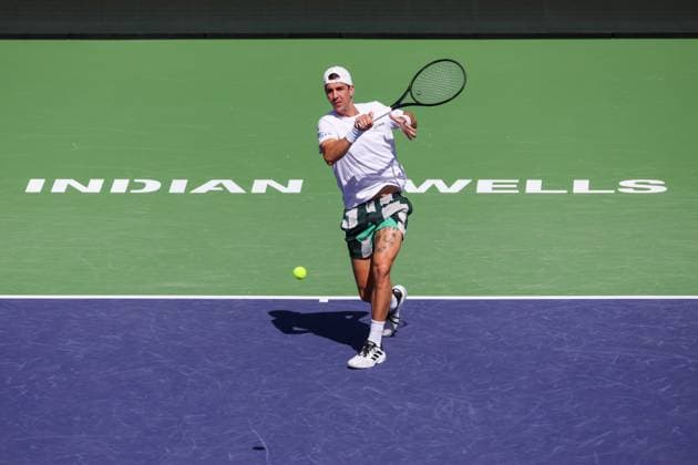 INDIAN WELLS, CA - MARCH 06: Thanasi Kokkinakis (AUS) hits a forehand during the BNP Paribas Open on March 6, 2024 at Indian Wells Tennis Garden in Indian Wells. CA. (Photo by George Walker Icon Sportswire) TENNIS: MAR 06 BNP Paribas Open EDITORIAL USE ONLY Icon240306001