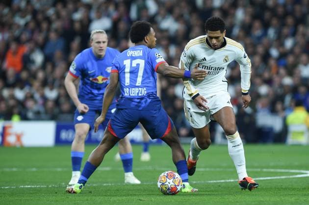 (240307) -- MADRID, March 7, 2024 -- Real Madrid s Jude Bellingham (R) vies with RB Leipzig s Lois Openda (C) during the UEFA Champions League Round of 16 2nd Leg match between RB Leipzig and Real Madrid at Bernabeu stadium, in Madrid, Spain, on March 6, 2024. (Photo by Xinhua) (SP)SPAIN-MADRID-FOOTBALL-UEFA CHAMPIONS LEAGUE-RB LEIPZIG VS REAL MADRID GustavoxValiente 