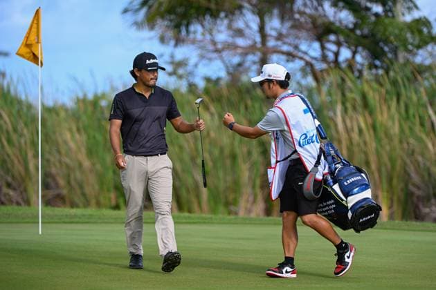 RIO GRANDE, PR - MARCH 07: Satoshi Kodaira (JPN) fist bumps his caddie after sinking his birdie putt on 17 during Rd1 of the Puerto Rico Open at Grand Reserve Country Club (Old) on March 7, 2024, in Rio Grande, Puerto Rico. (Photo by Ken Murray Icon Sportswire) GOLF: MAR 07 PGA, Golf Herren Puerto Rico Open EDITORIAL USE ONLY Icon240307029