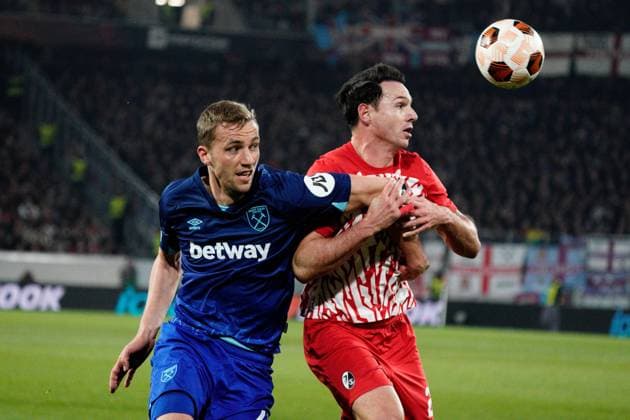Tomas Soucek of West Ham battles with Nicolas Hofler of SC Freiburg Freiburg v West Ham United, UEFA Europa League, Round of 16, First Leg, Football, Stade Europa-Park, Freiburg, Germany - 07 Mar 2024 EDITORIAL USE ONLY No use with unauthorised audio, video, data, fixture lists, club league logos or live services. Online in-match use limited to 120 images, no video emulation. No use in betting, games or single club league player publications. Copyright: xDavexWinter Shutterstockx 14373670ae