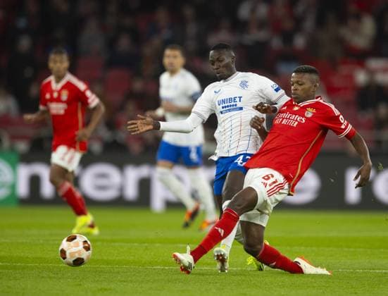Mohamed Diomande of Rangers and Florentino of Benfica during the Europa League Round of 16 Match at the Estadio da Luz, Lisbon. Benfica v Rangers, UEFA Europa League, Round of 16, First Leg, Football, Estadio da Luz, Lisbon, Portugal - 07 Mar 2024 EDITORIAL USE ONLY No use with unauthorised audio, video, data, fixture lists, club league logos or live services. Online in-match use limited to 120 images, no video emulation. No use in betting, games or single club league player publications. Copyright: xLukexNickerson RangersxFC Shutterstockx 14380036ba