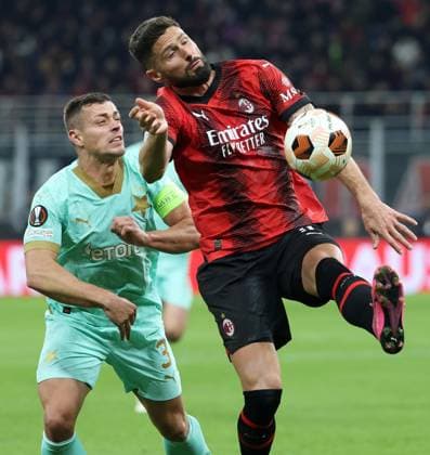 March 7, 2024, Milan, ITALY: Sk Slavia Praha s TomaÅ¡ HolÃ (L) challenges for the ball with AC Milan s Olivier Giroud during the UEFA Europa League round of 16 first leg between AC Milan and Sk Slavia Praha at Giuseppe Meazza stadium in Milan, 7 March 2024..ANSA MATTEO BAZZI. Soccer; Europe Legaue: Ac Milan vs Sk Slavia Praha  - ZUMAa110 20240307_zaf_a110_037 Copyright: xMatteoxBazzix