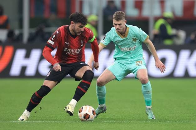 Milan, Italy, 7th March 2024. Theo Hernandez of AC Milan is pursued by David Doudera of Slavia Praha the UEFA Europa League match at Giuseppe Meazza, Milan. Picture credit should read: Jonathan Moscrop Sportimage EDITORIAL USE ONLY. No use with unauthorised audio, video, data, fixture lists, club league logos or live services. Online in-match use limited to 120 images, no video emulation. No use in betting, games or single club league player publications. SPI-2971-0012