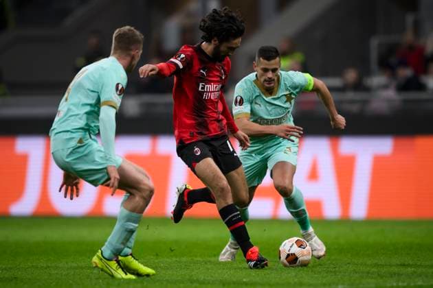 AC Milan v SK Slavia Praha - UEFA Europa League Yacine Adli of AC Milan competes for the ball with Tomas Holes and David Zima of SK Slavia Praha during the UEFA Europa League round of 16 first leg football match between AC Milan and SK Slavia Praha. Milan Italy Copyright: xNicolòxCampox