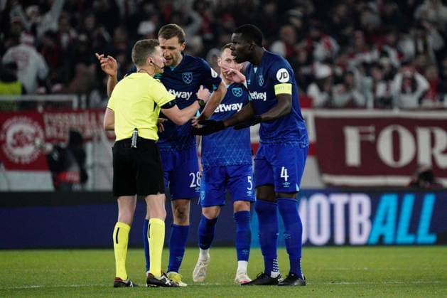 Tomas Soucek of West Ham and Kurt Zouma of West Ham seek explanations from the referee as to why no additional time was played following a lengthy but unsuccessful VAR check for a West Ham penalty at the end of the match Freiburg v West Ham United, UEFA Europa League, Round of 16, First Leg, Football, Stade Europa-Park, Freiburg, Germany - 07 Mar 2024 EDITORIAL USE ONLY No use with unauthorised audio, video, data, fixture lists, club league logos or live services. Online in-match use limited to 120 images, no video emulation. No use in betting, games or single club league player publications. Copyright: xDavexWinter Shutterstockx 14373670cl