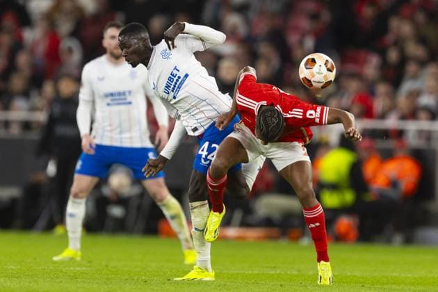 Mohamed Diomande of Rangers and David Neres of Benfica during the Europa League Round of 16 Match at the Estadio da Luz, Lisbon. Benfica v Rangers, UEFA Europa League, Round of 16, First Leg, Football, Estadio da Luz, Lisbon, Portugal - 07 Mar 2024 EDITORIAL USE ONLY No use with unauthorised audio, video, data, fixture lists, club league logos or live services. Online in-match use limited to 120 images, no video emulation. No use in betting, games or single club league player publications. Copyright: xLukexNickerson RangersxFC Shutterstockx 14380036fg