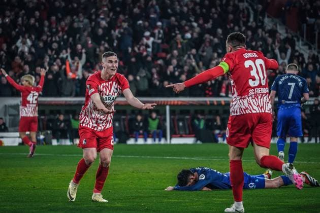 Soccer UEFA Europa League 2023 2024, round of 16, SC Freiburg West Ham United FC, Europa Park Stadium Freiburgs Roland Sallai and Freiburgs Christian Günter are euphorically happy about the 1-0 win by Freiburgs Michael Gregoritsch West Ham player lies on the ground Freiburg Stadion am Wolfswinkel Germany Copyright: xJoeranxSteinsiekx