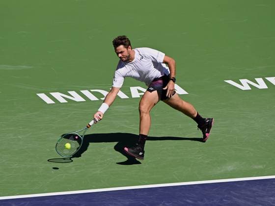 INDIAN WELLS, CA - MARCH 07: Stan Wawrinka (SUI) returns the ball during an ATP, Tennis Herren tennis match played on March 7, 2024 at the BNP Paribas Open at the Indian Wells Tennis Garden in Indian Wells, CA. (Photo by John Cordes Icon Sportswire) TENNIS: MAR 07 BNP Paribas Open EDITORIAL USE ONLY Icon506240307007