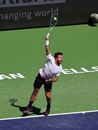 INDIAN WELLS, CA - MARCH 07: Stan Wawrinka (SUI) serving during an ATP, Tennis Herren tennis match played on March 7, 2024 at the BNP Paribas Open at the Indian Wells Tennis Garden in Indian Wells, CA. (Photo by John Cordes Icon Sportswire) TENNIS: MAR 07 BNP Paribas Open EDITORIAL USE ONLY Icon506240307011