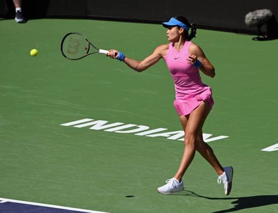 INDIAN WELLS, CA - MARCH 07: Emma Raducanu (GBR) in the air after hitting the ball during a WTA, Tennis Damen tennis match played on March 7, 2024 at the BNP Paribas Open at the Indian Wells Tennis Garden in Indian Wells, CA. (Photo by John Cordes Icon Sportswire) TENNIS: MAR 07 BNP Paribas Open EDITORIAL USE ONLY Icon506240307032