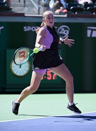 INDIAN WELLS, CA - MARCH 08: Jelena Ostapenko (LAT) returns the ball during a WTA, Tennis Damen tennis match played on March 8, 2024 during the BNP Paribas Open played at the Indian Wells Tennis Garden in Indian Wells, CA. (Photo by John Cordes Icon Sportswire) TENNIS: MAR 08 BNP Paribas Open EDITORIAL USE ONLY Icon506240308009