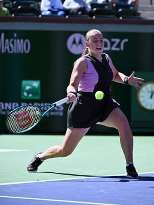 INDIAN WELLS, CA - MARCH 08: Jelena Ostapenko (LAT) returns the ball during a WTA, Tennis Damen tennis match played on March 8, 2024 during the BNP Paribas Open played at the Indian Wells Tennis Garden in Indian Wells, CA. (Photo by John Cordes Icon Sportswire) TENNIS: MAR 08 BNP Paribas Open EDITORIAL USE ONLY Icon506240308013