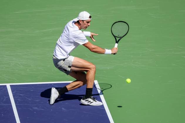 INDIAN WELLS, CA - MARCH 08: Thanasi Kokkinakis (AUS) hits a backhand during the BNP Paribas Open on March 8, 2024 at Indian Wells Tennis Garden in Indian Wells, CA. (Photo by George Walker Icon Sportswire) TENNIS: MAR 08 BNP Paribas Open EDITORIAL USE ONLY Icon240308006