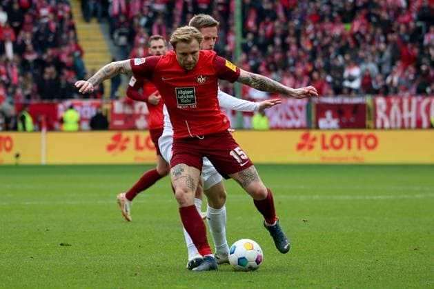 10 03 2024, xmohx, Fußball 2 Bundesliga, 1 FC Kaiserslautern VfL Osnabrück emspor, v l Tymoteusz Puchacz 1 FC Kaiserslautern Jannes Wulf VfL Osnabrueck Osnabrück Zweikampf, Aktion, action, battle for the ball DFL DFB REGULATIONS PROHIBIT ANY USE OF PHOTOGRAPHS as IMAGE SEQUENCES and or QUASI VIDEO Kaiserslautern