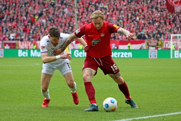 10 03 2024, xmohx, Fußball 2 Bundesliga, 1 FC Kaiserslautern VfL Osnabrück emspor, v l Charalampos Makridis VfL Osnabrueck Osnabrück Tymoteusz Puchacz 1 FC Kaiserslautern Zweikampf, Aktion, action, battle for the ball DFL DFB REGULATIONS PROHIBIT ANY USE OF PHOTOGRAPHS as IMAGE SEQUENCES and or QUASI VIDEO Kaiserslautern