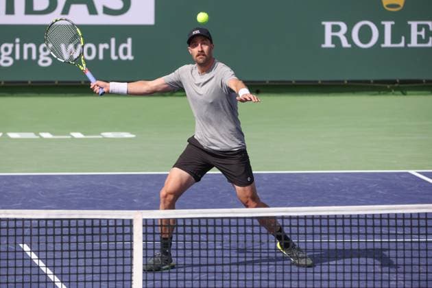 INDIAN WELLS, CA - MARCH 10: Steve Johnson (USA) hits a volley during the BNP Paribas Open on March 10, 2024 at Indian Wells Tennis Garden in Indian Wells, CA. (Photo by George Walker Icon Sportswire) TENNIS: MAR 10 BNP Paribas Open EDITORIAL USE ONLY Icon240310105