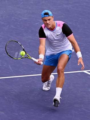 INDIAN WELLS, CA - MARCH 11: Holger Rune (DEN) charges the net to return the ball during an ATP, Tennis Herren tennis match played on March 11, 2024 during the BNP Paribas Open played at the Indian Wells Tennis Garden in Indian Wells, CA. (Photo by John Cordes Icon Sportswire) TENNIS: MAR 11 BNP Paribas Open EDITORIAL USE ONLY Icon506240311001
