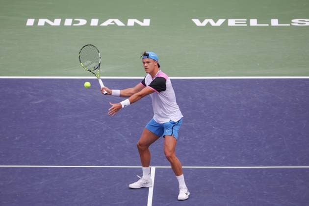 INDIAN WELLS, CA - MARCH 11: Holger Rune (DEN) hits a volley during the BNP Paribas Open on March 11, 2024 at Indian Wells Tennis Garden in Indian Wells, CA. (Photo by George Walker Icon Sportswire) TENNIS: MAR 11 BNP Paribas Open EDITORIAL USE ONLY Icon240311001