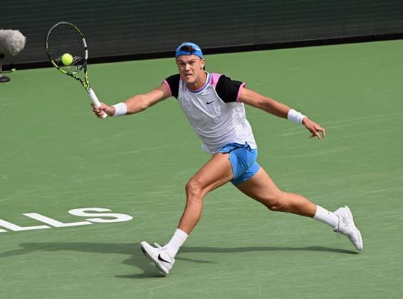 INDIAN WELLS, CA - MARCH 11: Holger Rune (DEN) chases after and returns the ball during an ATP, Tennis Herren tennis match played on March 11, 2024 during the BNP Paribas Open played at the Indian Wells Tennis Garden in Indian Wells, CA. (Photo by John Cordes Icon Sportswire) TENNIS: MAR 11 BNP Paribas Open EDITORIAL USE ONLY Icon506240311015
