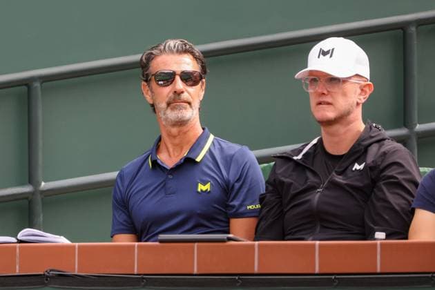 INDIAN WELLS, CA - MARCH 11: Tennis coach Patrick Mouratoglou (l) watches Holger Rune (DEN) play during the BNP Paribas Open on March 11, 2024 at Indian Wells Tennis Garden in Indian Wells, CA. (Photo by George Walker Icon Sportswire) TENNIS: MAR 11 BNP Paribas Open EDITORIAL USE ONLY Icon240311014