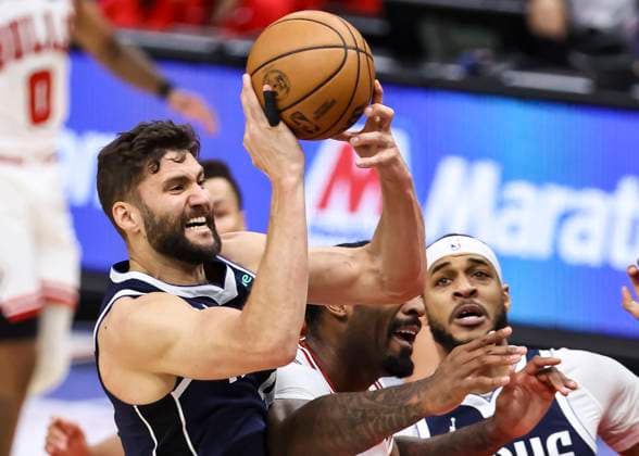 (240312) -- CHICAGO, March 12, 2024 -- Dallas Mavericks forward Maxi Kleber (L) grabs a rebound during NBA, Basketball Herren, USA regular season game between Chicago Bulls and Dallas Mavericks in Chicago, the United States, on March 11, 2024. (Photo by Xinhua) (SP)U.S.-CHICAGO-BASKETBALL-NBA-BULLS VS MAVERICKS JoelxLerner 
