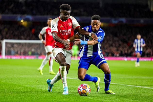 Arsenal v FC Porto Champions League 12 03 2024. Round of 16 Bukayo Saka (7) of Arsenal battles with Wilson Manafa (18) of FC Porto during the Champions League match between Arsenal and FC Porto at the Emirates Stadium, London, England on 12 March 2024. Editorial use only , Copyright: xNigelxKeenex PSI-19227-0013