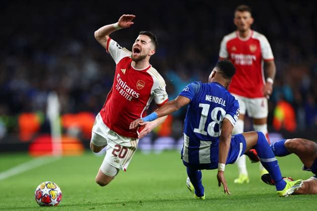 Jorginho of Arsenal fouled by Wendell of FC Porto Arsenal v Porto, UEFA Champions League, Round of 16, Second Leg, Football, Emirates Stadium, London, UK - 12 Mar 2024 EDITORIAL USE ONLY No use with unauthorised audio, video, data, fixture lists, club league logos or live services. Online in-match use limited to 120 images, no video emulation. No use in betting, games or single club league player publications. Copyright: xSimonxDael Shutterstockx 14384999aj