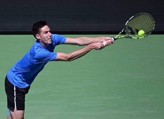 INDIAN WELLS, CA - MARCH 12: Fabian Marozsan (HUN) returns the ball during an ATP, Tennis Herren tennis match played on March 12, 2024 during the BNP Paribas Open played at the Indian Wells Tennis Garden in Indian Wells, CA. (Photo by John Cordes Icon Sportswire) TENNIS: MAR 12 BNP Paribas Open EDITORIAL USE ONLY Icon506240312113