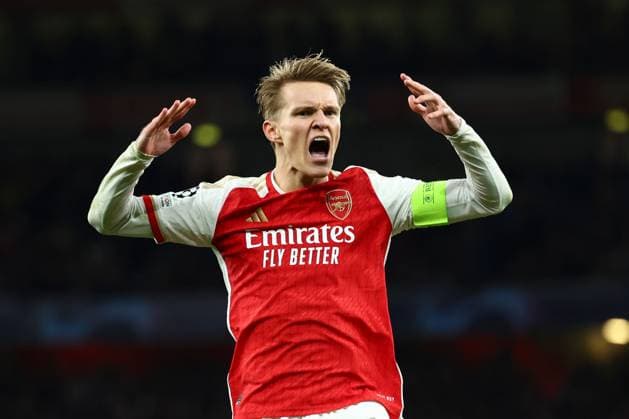 Martin Odegaard of Arsenal celebrates after scoring his opening penalty Arsenal v Porto, UEFA Champions League, Round of 16, Second Leg, Football, Emirates Stadium, London, UK - 12 Mar 2024 EDITORIAL USE ONLY No use with unauthorised audio, video, data, fixture lists, club league logos or live services. Online in-match use limited to 120 images, no video emulation. No use in betting, games or single club league player publications. Copyright: xSimonxDael Shutterstockx 14384999bm