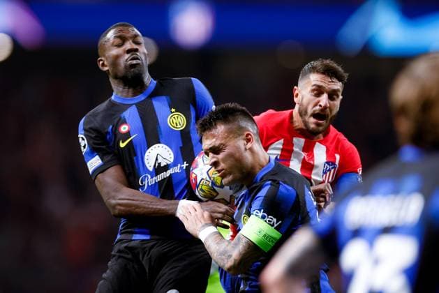 Marcus Thuram (FC Internazionale), Lautaro Martinez (FC Internazionale) and Koke (Atletico de Madrid) battle for the ball, UEFA Champions League 2023 2024 - Round of 16 second leg, Atletico Madrid vs FC Internazionale, CIvitas Metropolitano Stadium, March 13, 2024, Madrid, Spain.