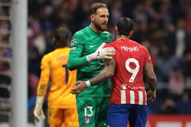 Madrid, Spain, 13th March 2024. Memphis Depay of Atletico Madrid celebrates with team mate Jan Oblak after scoring in the penalty shoot out of the UEFA Champions League match at Estadio Metropolitano,, Madrid. Picture credit should read: Jonathan Moscrop Sportimage EDITORIAL USE ONLY. No use with unauthorised audio, video, data, fixture lists, club league logos or live services. Online in-match use limited to 120 images, no video emulation. No use in betting, games or single club league player publications. SPI-2991-0064
